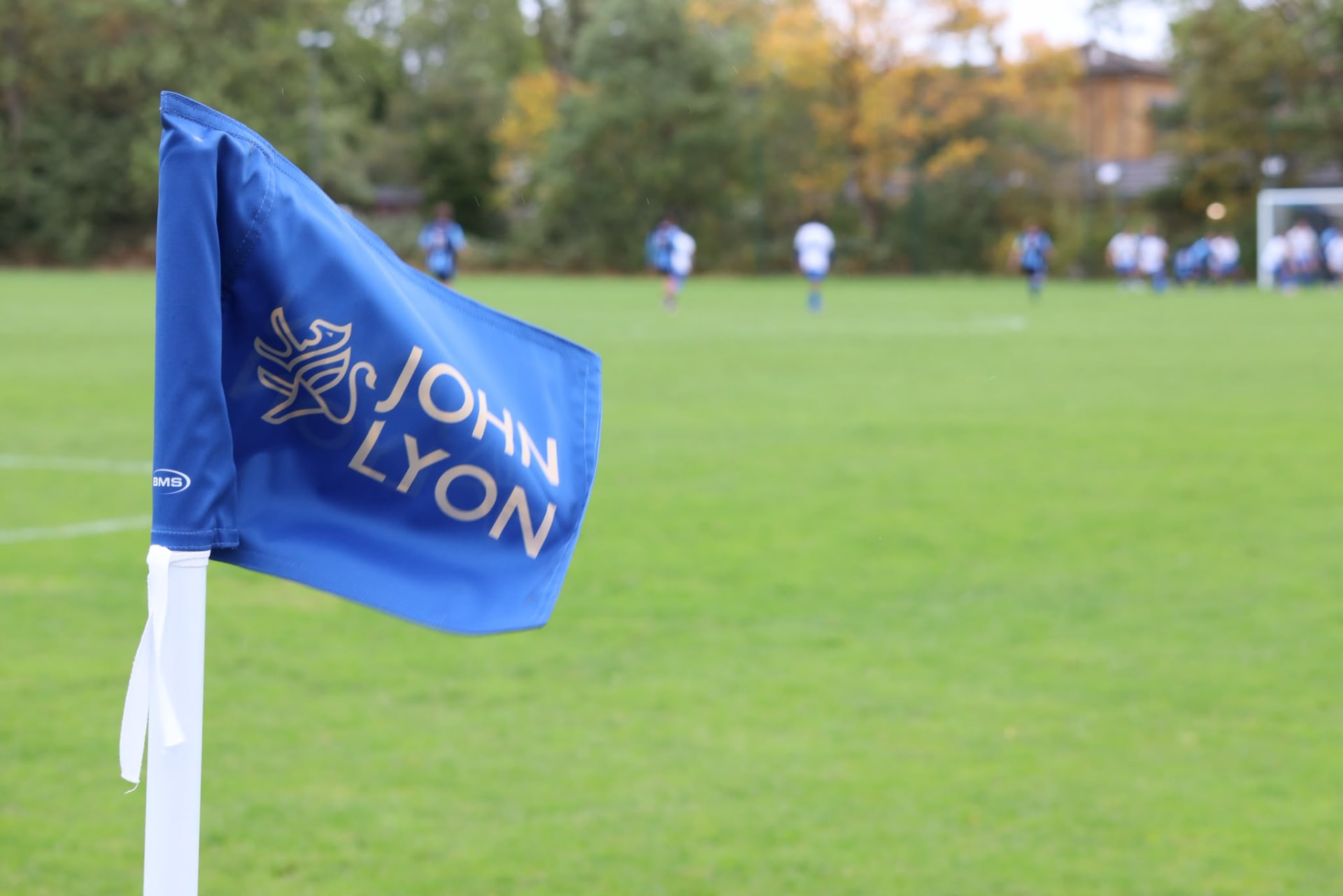 Old Lyonians corner flag beside the pitch
